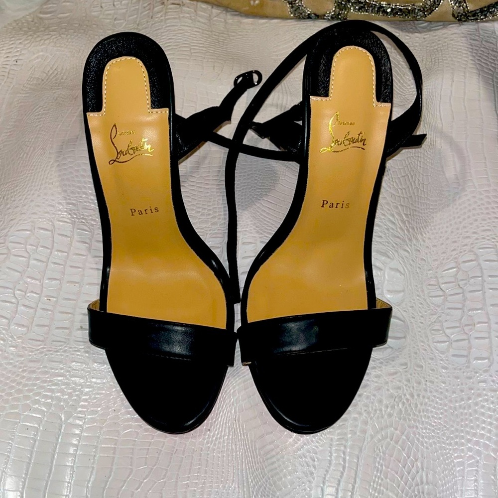 Louboutin heels with wrap ankle. Only worn once.